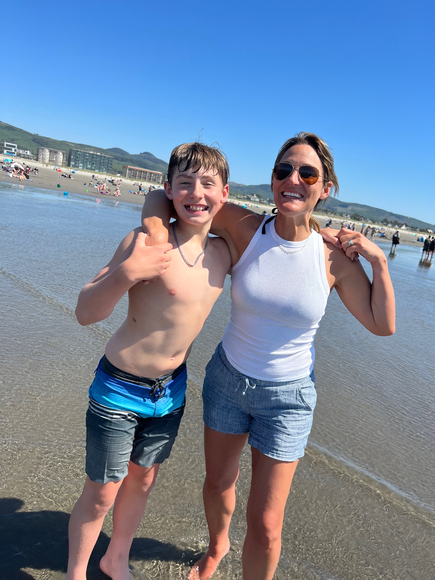 Mom and son playing on the beach in Seaside